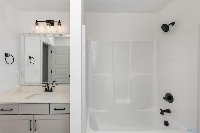 bathroom featuring vanity and shower / washtub combination