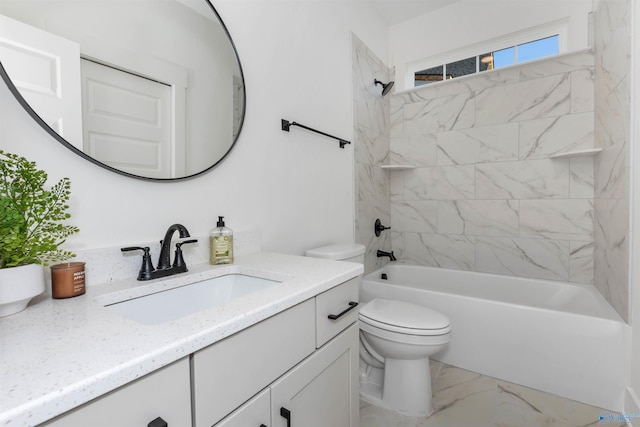 full bathroom featuring toilet, vanity, and tiled shower / bath