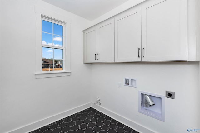 washroom with hookup for an electric dryer, washer hookup, gas dryer hookup, and cabinets