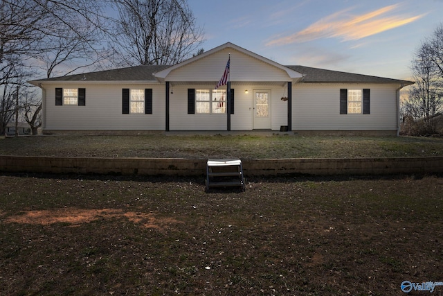 view of front of home with a yard