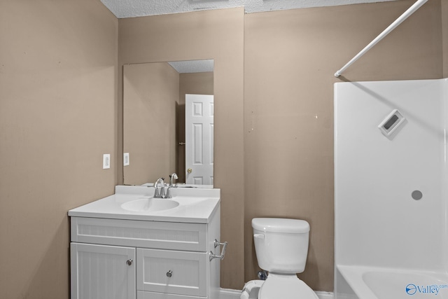 full bath with toilet, a textured ceiling, shower / bathtub combination, and vanity