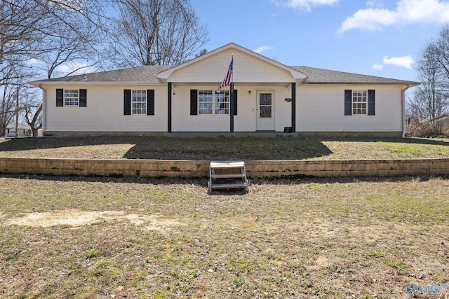 ranch-style home featuring a front yard