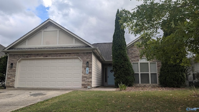 view of front of home featuring a garage and a front lawn