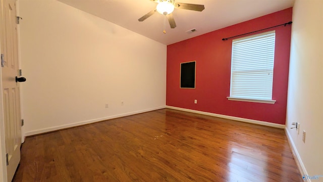 unfurnished room with hardwood / wood-style flooring and ceiling fan