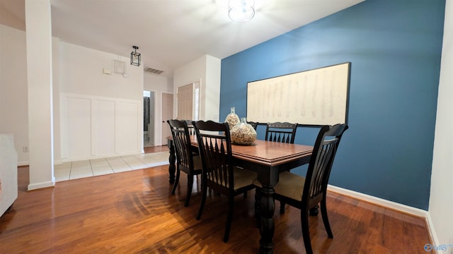 dining space with light wood-type flooring