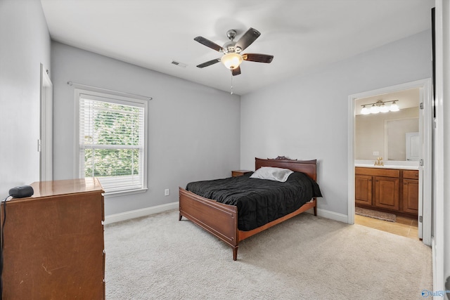 105 Cherrywood Dr, Madison, AL 35756 - bedroom featuring light colored carpet, connected bathroom, and ceiling fan
