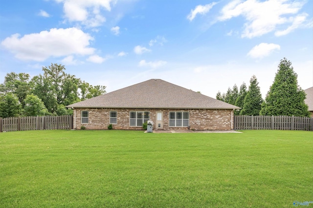 105 Cherrywood Dr, Madison, AL 35756 - rear view of house with a fenced backyard, brick siding, and roof with shingles