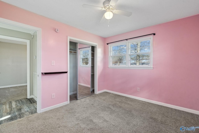 unfurnished bedroom featuring carpet flooring, ceiling fan, and a closet