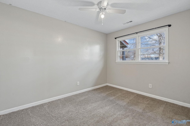 carpeted empty room featuring ceiling fan