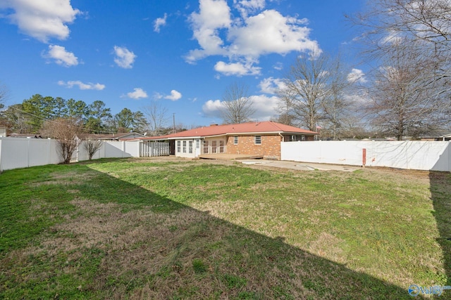 view of yard with french doors and a patio