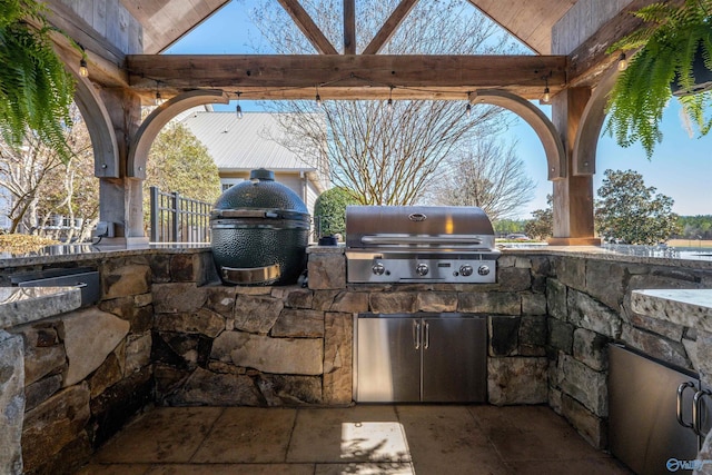 view of patio / terrace featuring a grill and exterior kitchen