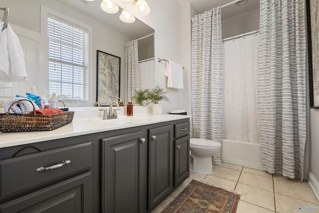 bathroom with tile patterned flooring, toilet, vanity, and shower / bath combo with shower curtain