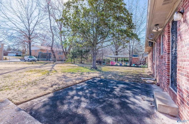 view of yard with a patio and fence