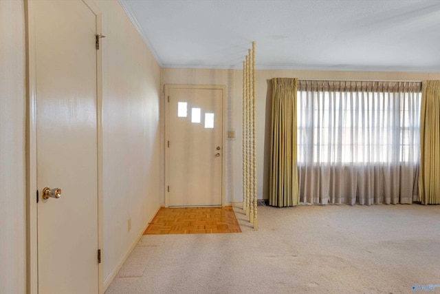 entrance foyer featuring ornamental molding