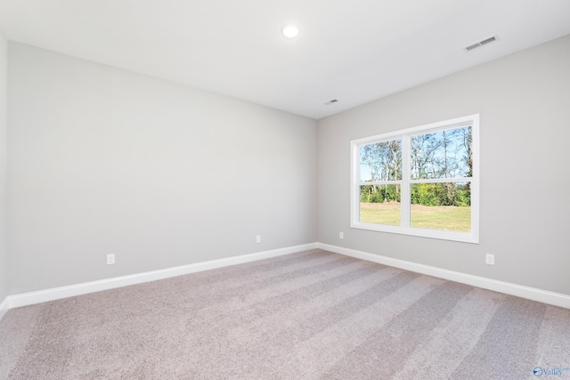 spare room featuring carpet floors