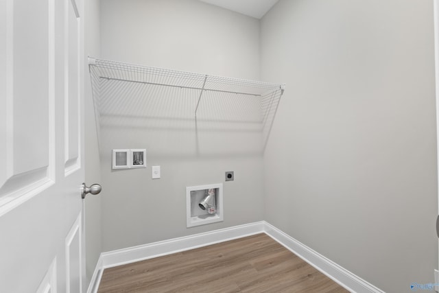 washroom with wood-type flooring, hookup for a washing machine, and electric dryer hookup