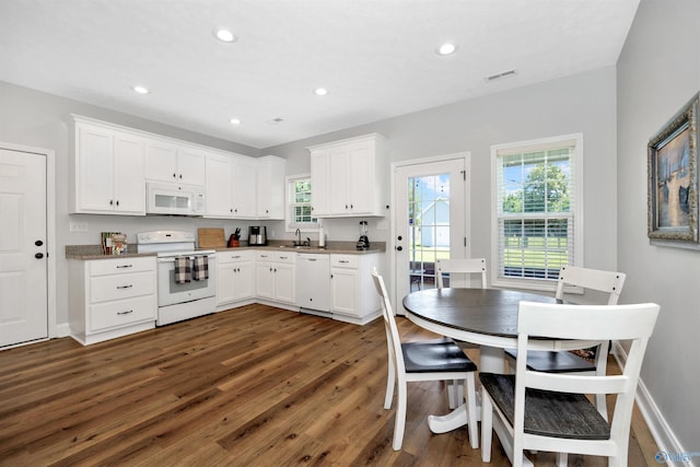16290 Log Cabin Rd, Athens, AL 35611 - kitchen featuring white appliances, dark wood-type flooring, white cabinets, recessed lighting, and a sink