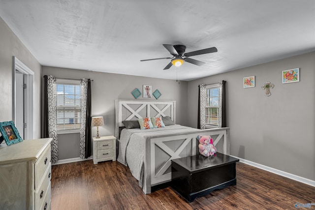 bedroom with ceiling fan and dark hardwood / wood-style flooring