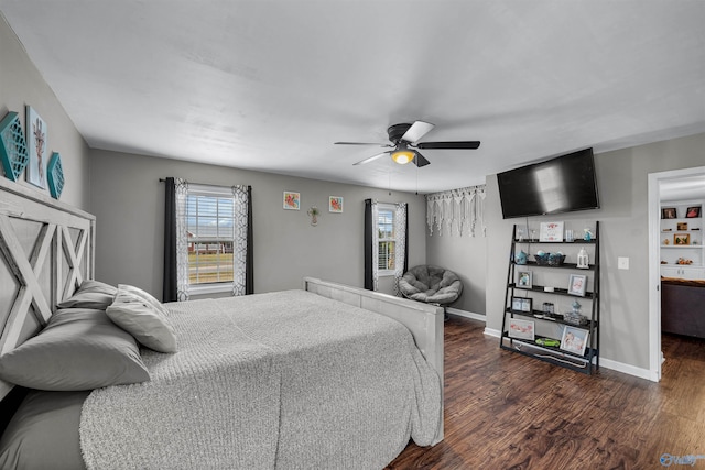 bedroom with ceiling fan and dark wood-type flooring