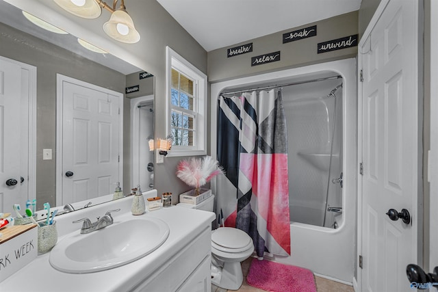 full bathroom featuring tile patterned flooring, shower / bath combination with curtain, vanity, and toilet