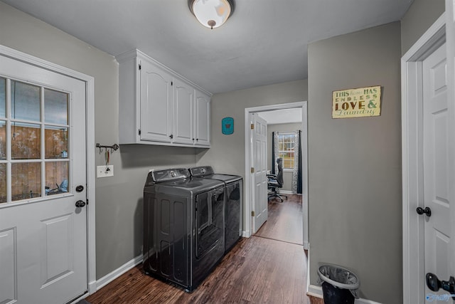 laundry area featuring dark hardwood / wood-style floors, cabinets, and independent washer and dryer