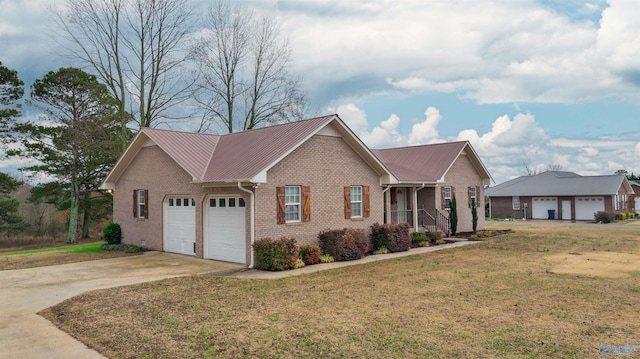 view of front facade featuring a garage and a front lawn