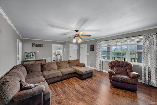 living room with ceiling fan, dark hardwood / wood-style flooring, and ornamental molding