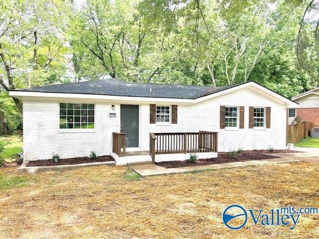 2618 NW Mountain Park Cir, Huntsville, AL 35810 - ranch-style house with brick siding and view of wooded area