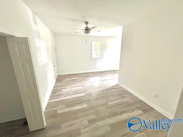 2618 NW Mountain Park Cir, Huntsville, AL 35810 - empty room featuring ceiling fan and wood finished floors