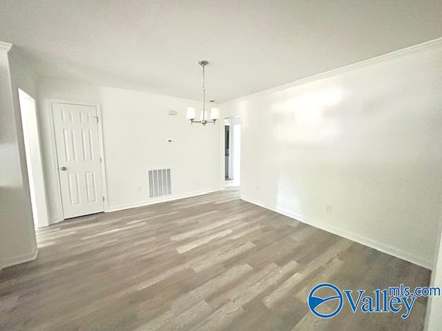 2618 NW Mountain Park Cir, Huntsville, AL 35810 - unfurnished dining area featuring a chandelier and wood finished floors