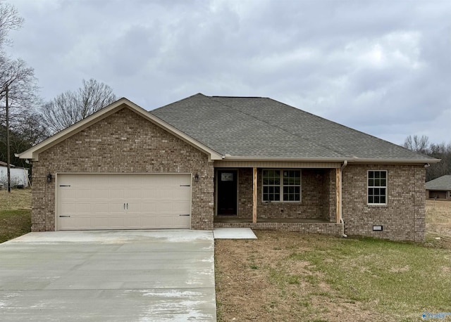 ranch-style house with driveway, an attached garage, brick siding, and roof with shingles
