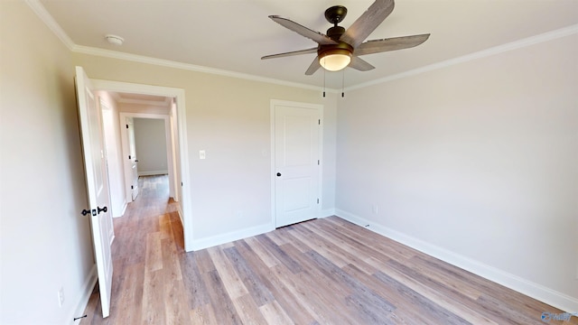 13680 Grigsby Ferry Rd, Elkmont, AL 35620 - unfurnished bedroom with light wood-style flooring, crown molding, baseboards, and ceiling fan