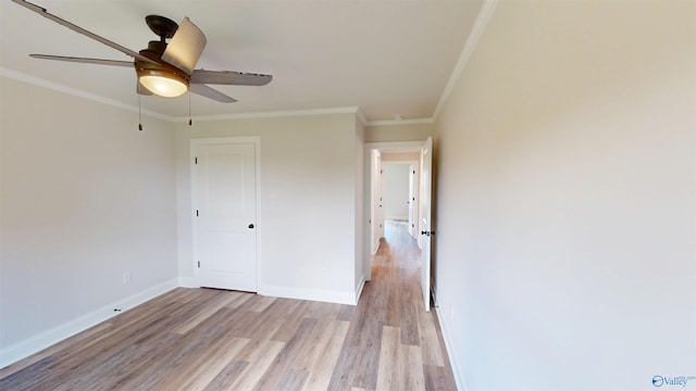 13680 Grigsby Ferry Rd, Elkmont, AL 35620 - unfurnished bedroom featuring light wood finished floors, crown molding, baseboards, a closet, and ceiling fan