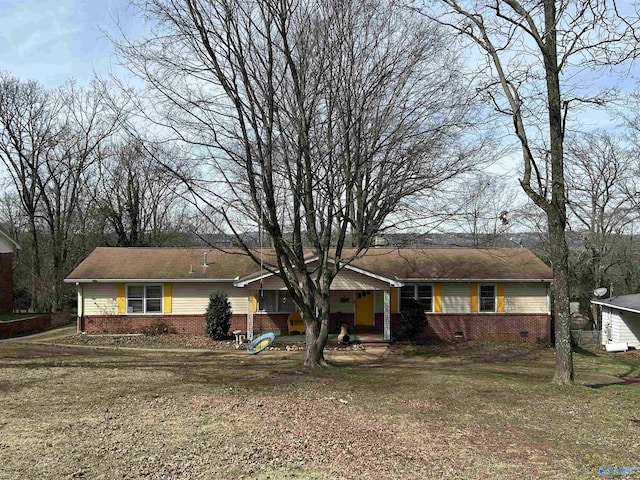 single story home with crawl space, a front yard, and brick siding