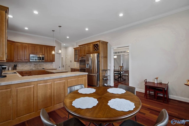 dining space with ornamental molding, dark wood-type flooring, recessed lighting, and baseboards