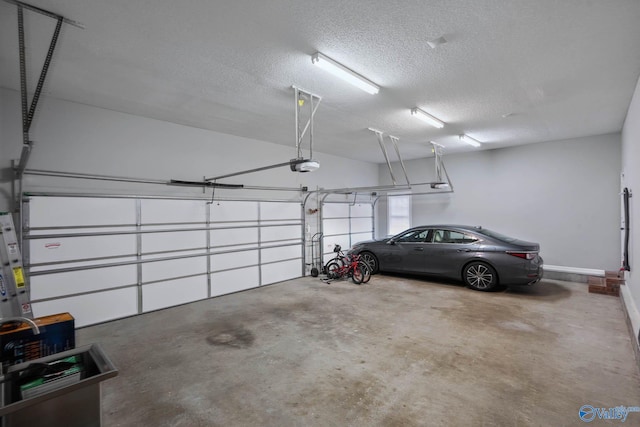 garage featuring baseboards and a garage door opener