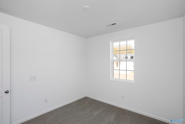 empty room with carpet flooring