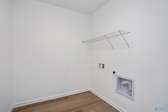 clothes washing area featuring hookup for an electric dryer, washer hookup, and dark hardwood / wood-style flooring