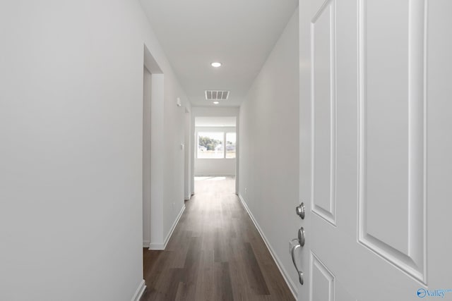 corridor featuring dark wood-type flooring