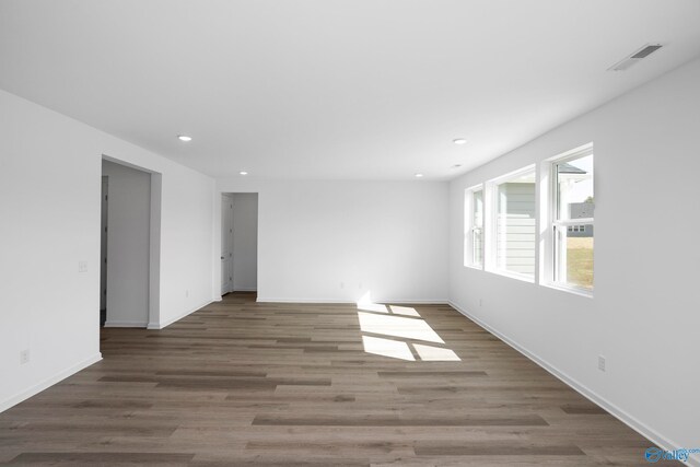 empty room with dark wood-type flooring