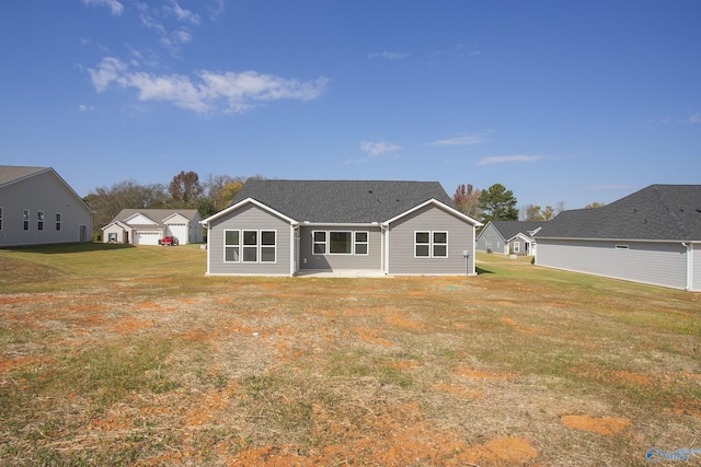 back of house with a yard