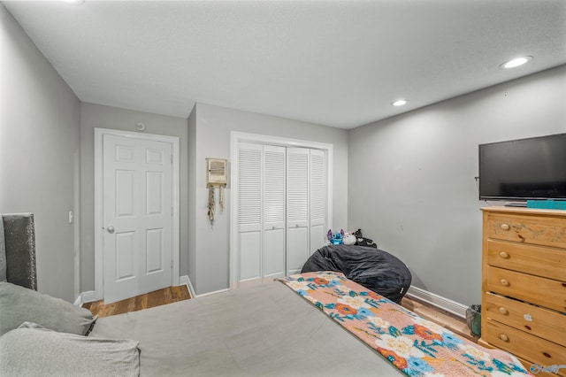 bedroom featuring a closet and hardwood / wood-style floors