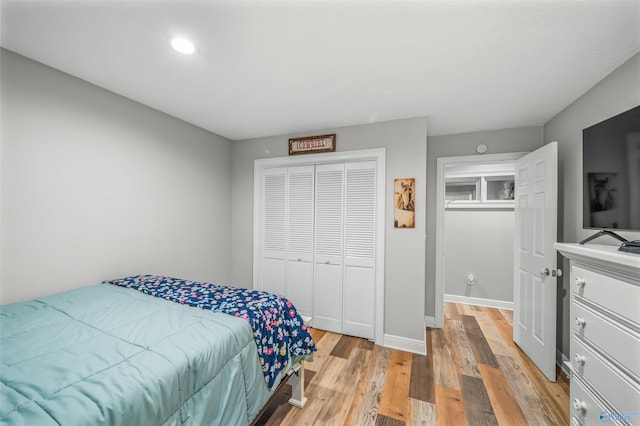 bedroom featuring a closet and light hardwood / wood-style flooring