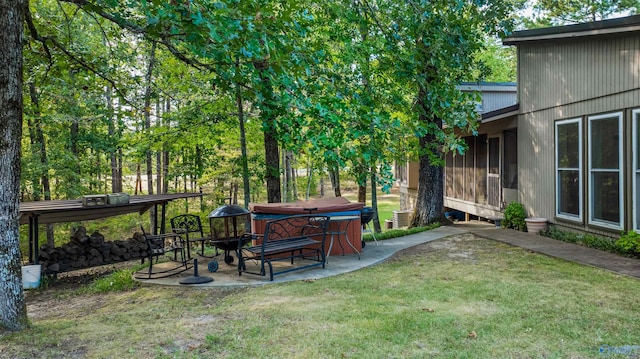 view of yard featuring a patio and a hot tub