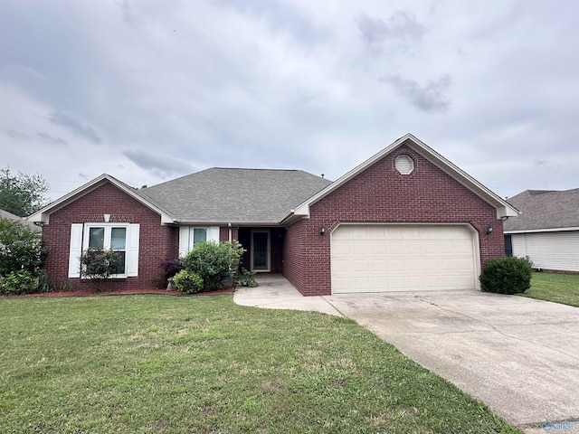 203 Lincoln Ave, Muscle Shoals, AL 35661 - ranch-style house featuring brick siding, a garage, driveway, a front yard, and roof with shingles