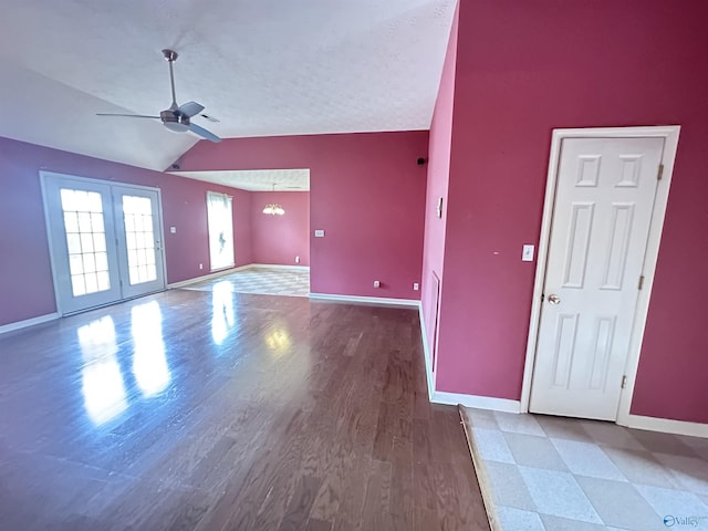 203 Lincoln Ave, Muscle Shoals, AL 35661 - unfurnished living room featuring lofted ceiling, a ceiling fan, baseboards, and wood finished floors