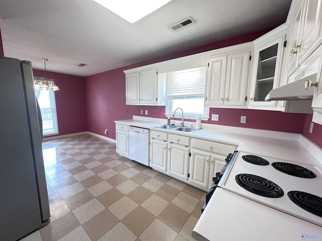 203 Lincoln Ave, Muscle Shoals, AL 35661 - kitchen with freestanding refrigerator, dishwasher, a sink, electric range oven, and white cabinets