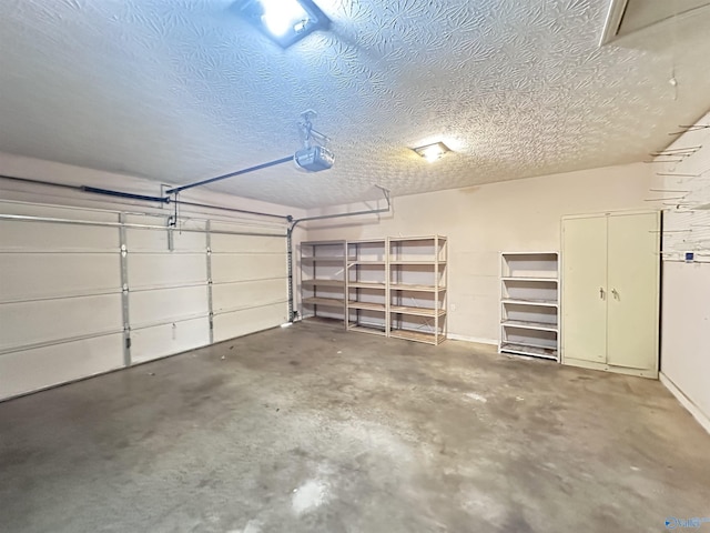 203 Lincoln Ave, Muscle Shoals, AL 35661 - garage featuring a garage door opener and baseboards