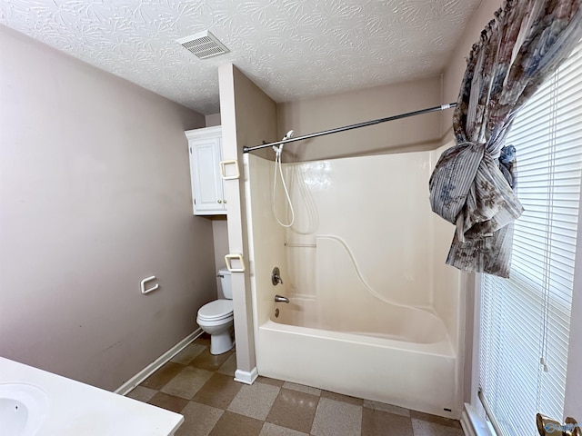 203 Lincoln Ave, Muscle Shoals, AL 35661 - full bathroom with baseboards, toilet,  shower combination, tile patterned floors, and vanity