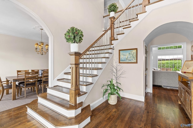 758 County Road 555, Valley Head, AL 35989 - stairway with arched walkways, wood finished floors, a chandelier, baseboards, and a high ceiling